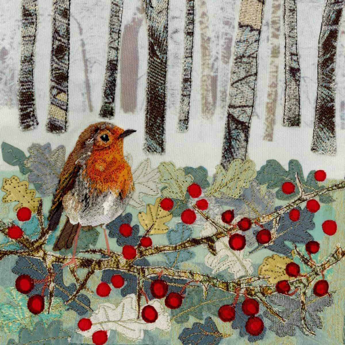 Colorful embroidered woodland scene with a bird, trees, and berries, showcasing textile art and fabric embroidery techniques.