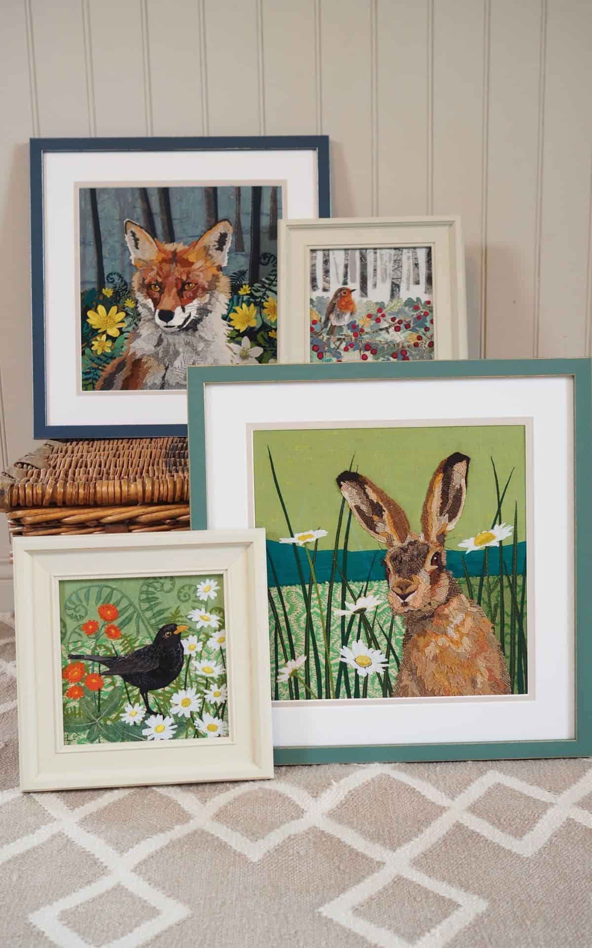 Vibrant embroidered wildlife artwork featuring rabbits, birds, and forest animals, perfect for nature-inspired home décor.
